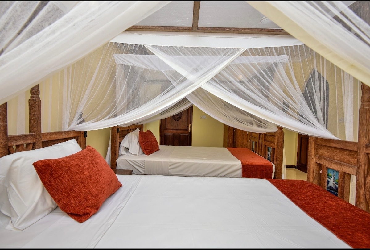 Twin beds under shared canopy — clean and elegant
